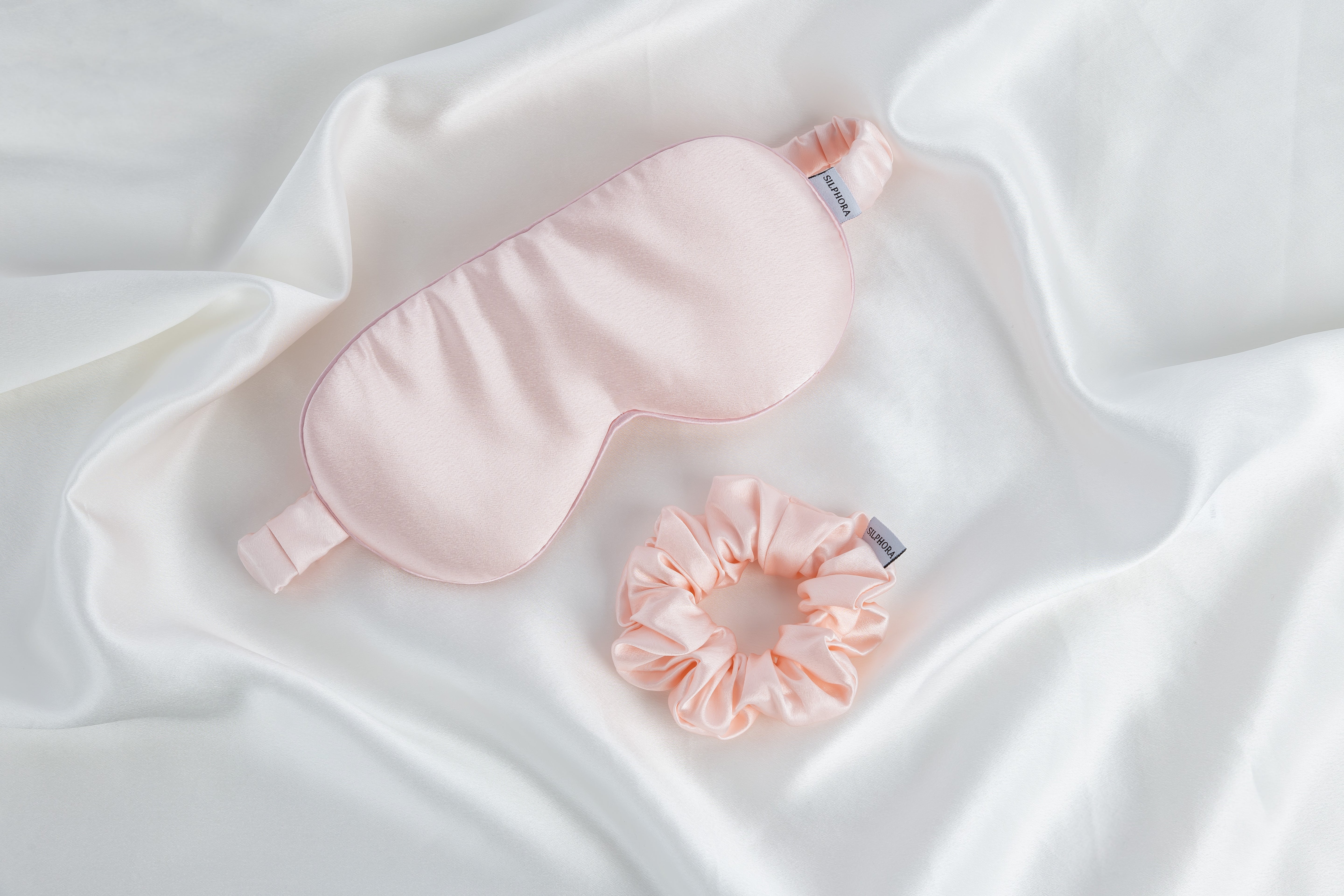 Powder Pink silk gift set including pillowcase, eye mask, and scrunchie, made from 100% mulberry silk for smooth hair and glowing skin, presented in an elegant gift box